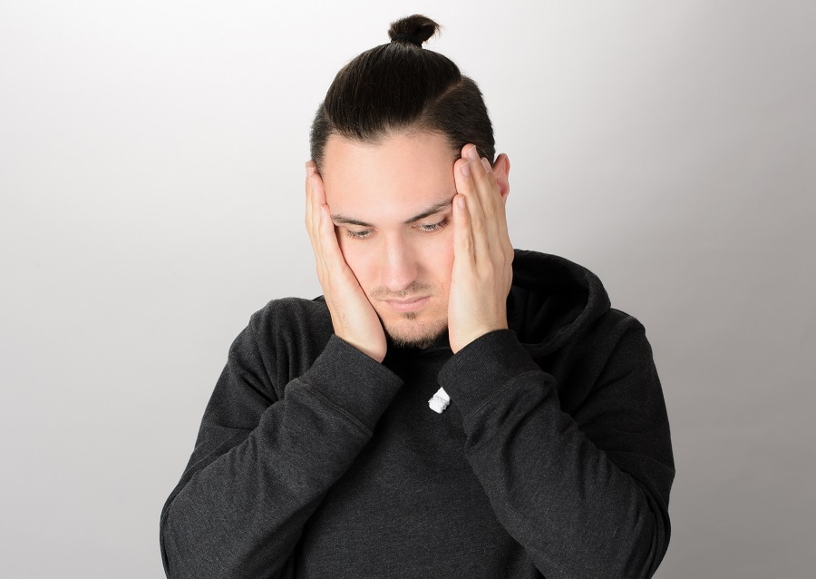 man bun with slick back hairstyle