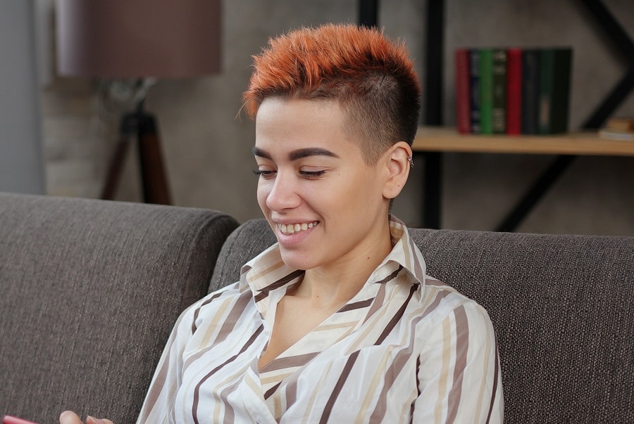 girl with spiky red hairstyle and undercut