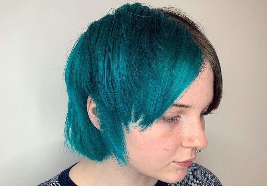 short shaggy hairstyle with teal blue hair