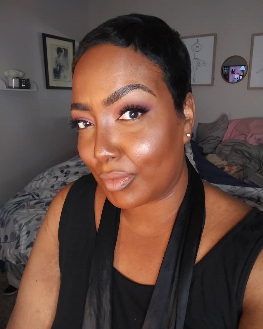 black woman with short haircut and double chin