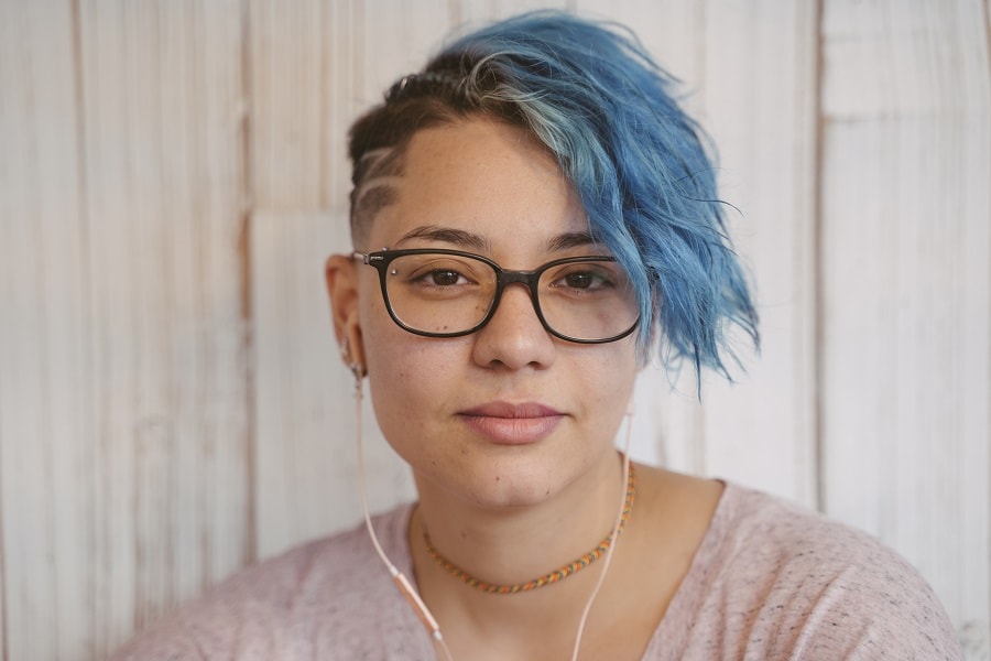 undercut with thick hair and blue highlights