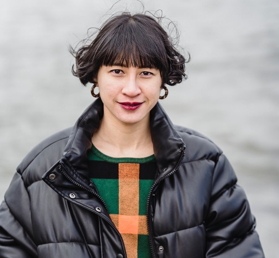 thick curly bob with bangs