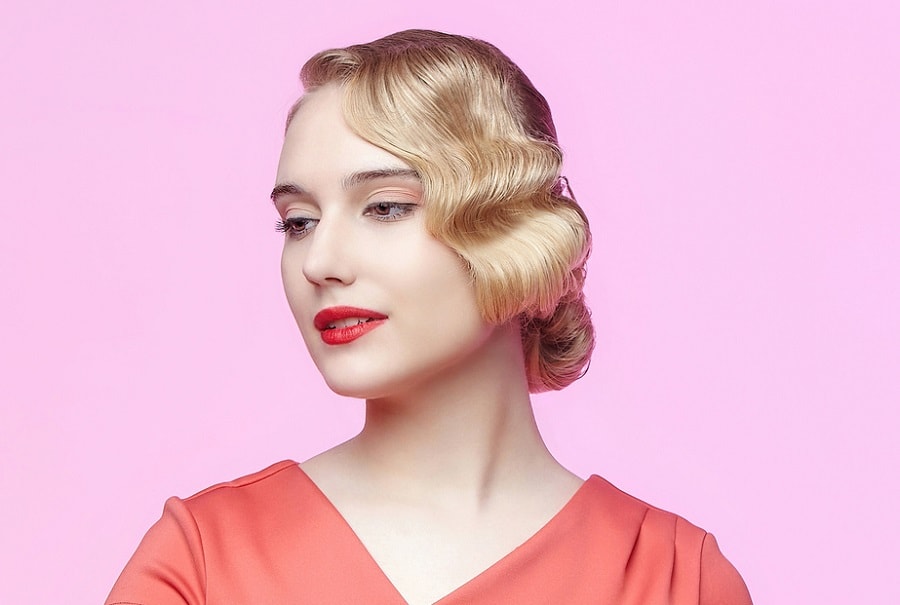 short and sleek blonde bob with finger wave