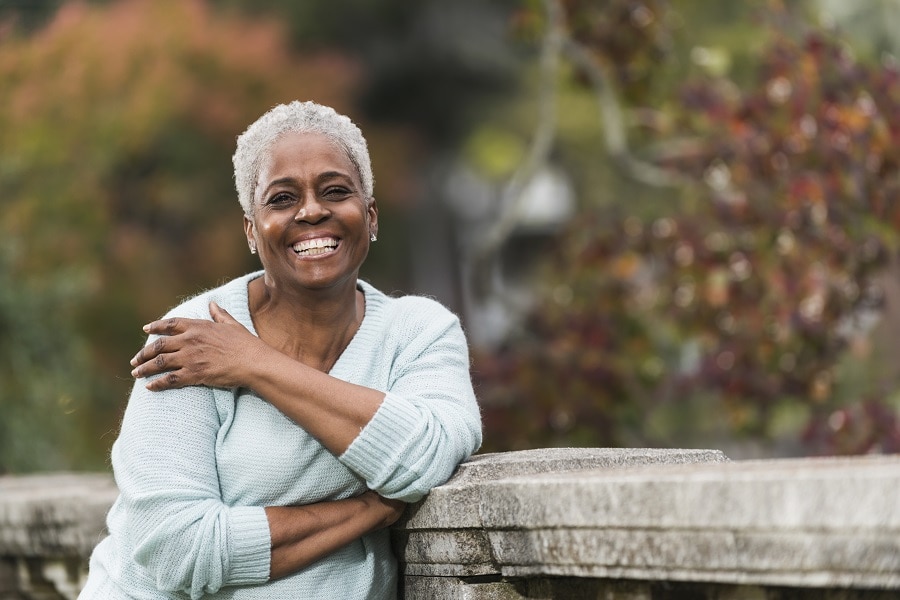 older woman with short afro hair