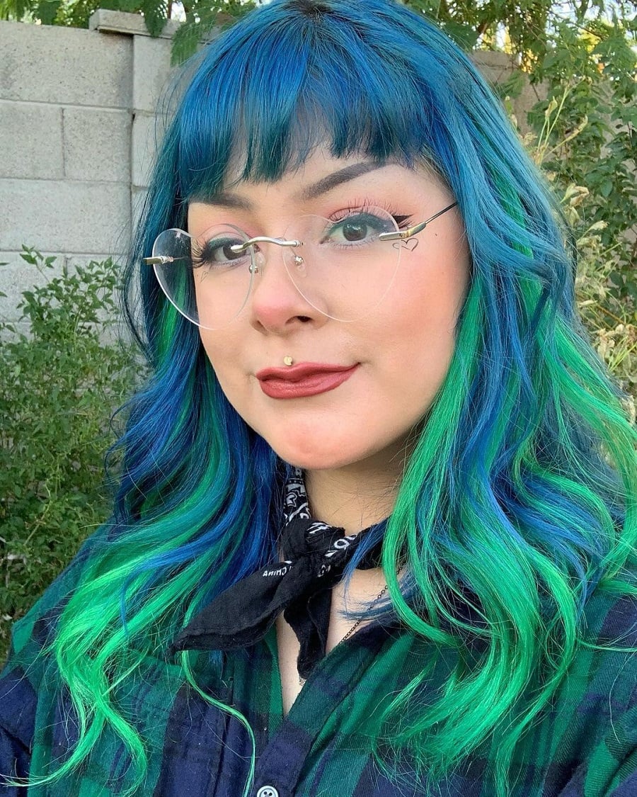 funky blue hair with bangs and green highlights
