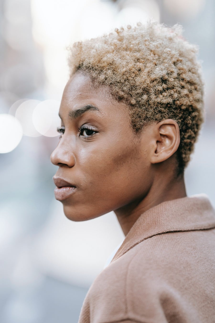 black woman with short brown afro hair