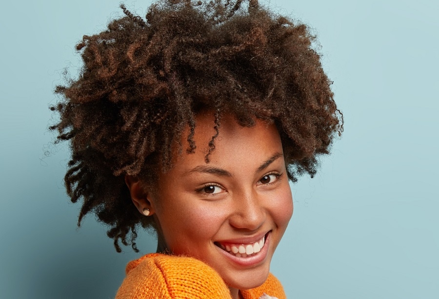 black woman with short brunette afro hair