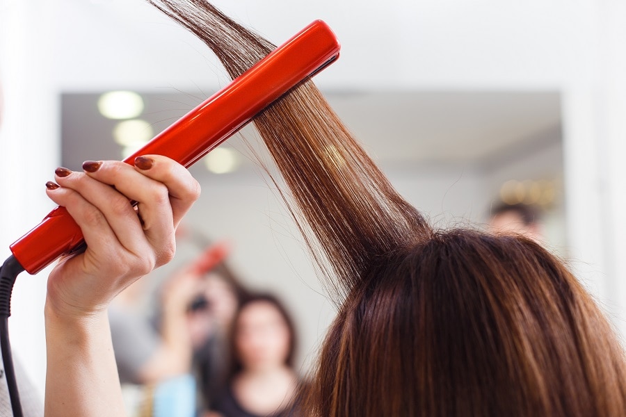 use less heat styling products to prevent hair from getting dry