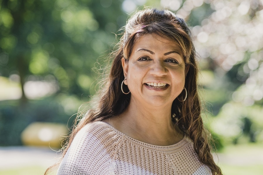 woman over 50 with double chin and long hairstyle