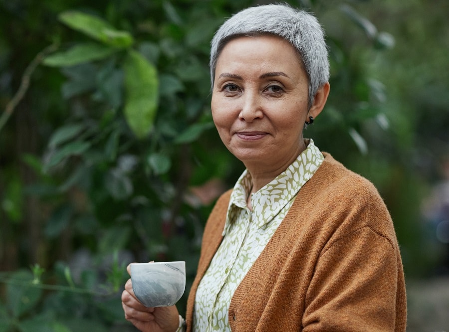 woman over 50 with round face and gray short hair