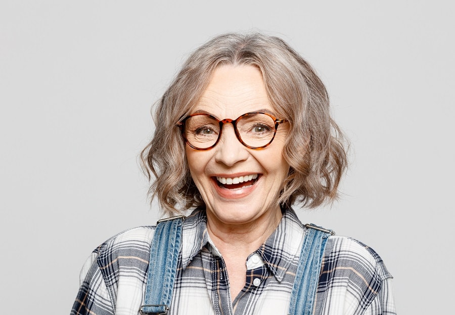 woman over 50 with wavy bob and glasses