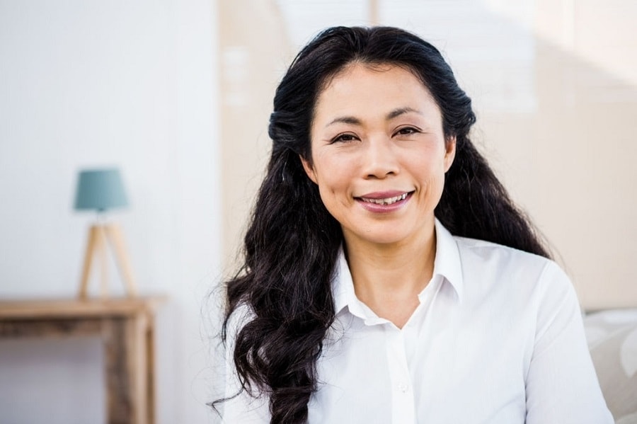 Asian woman over 50 with thick long hair