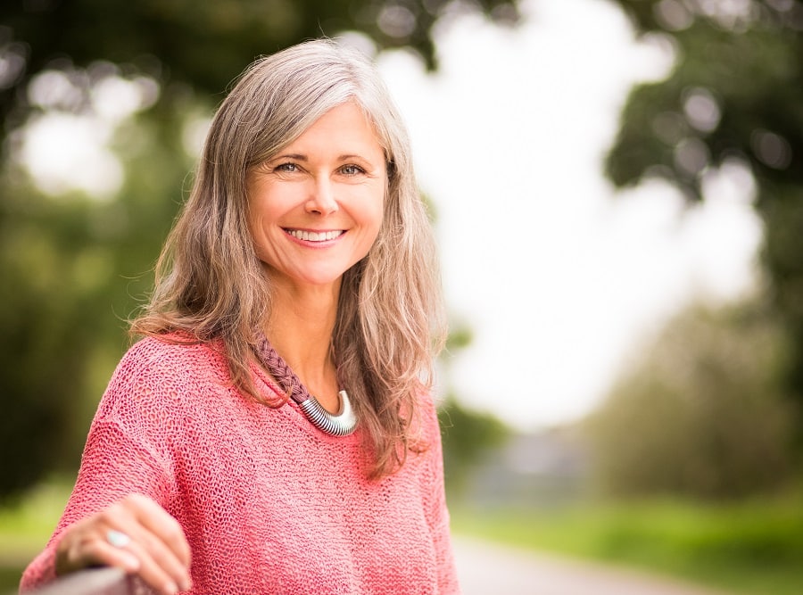 woman over 50 with long gray hair