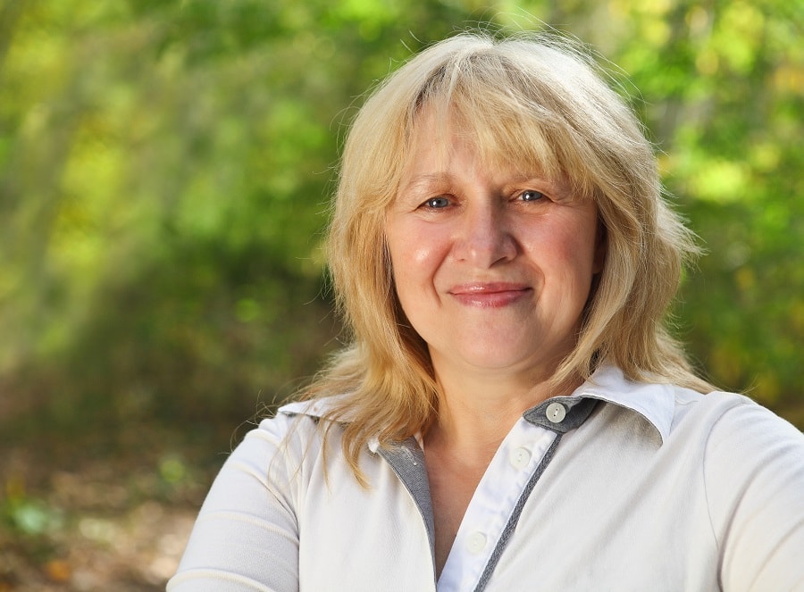 older woman blonde hairstyle with bangs