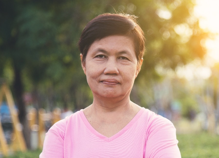 Asian older woman with very short hairstyle