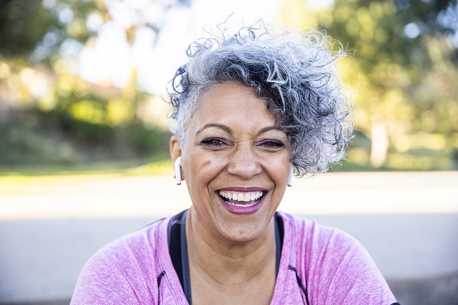 woman over 50 with two tone curly hair