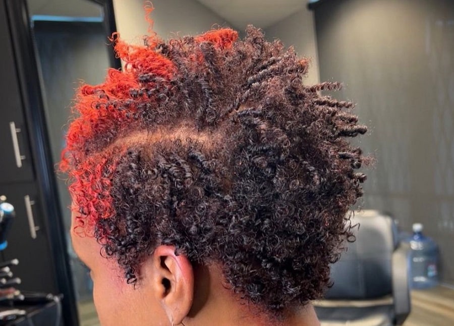 coil hairstyle with red highlights
