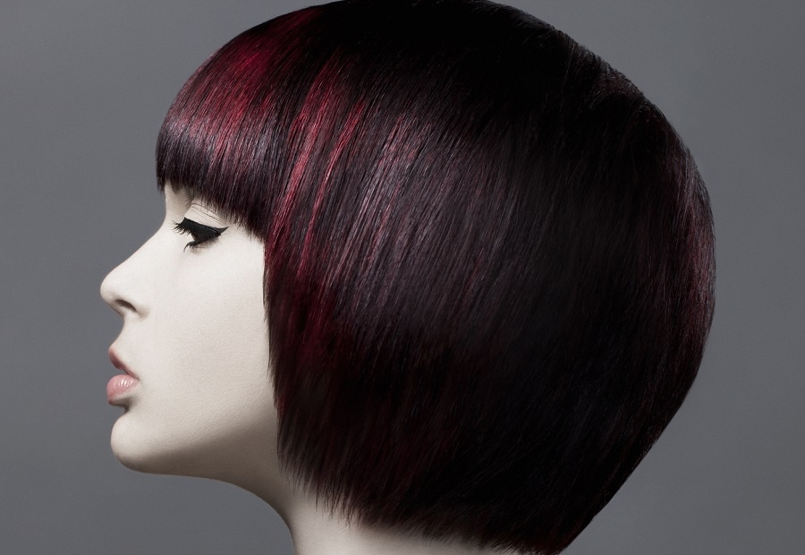 thick short bob with red highlights