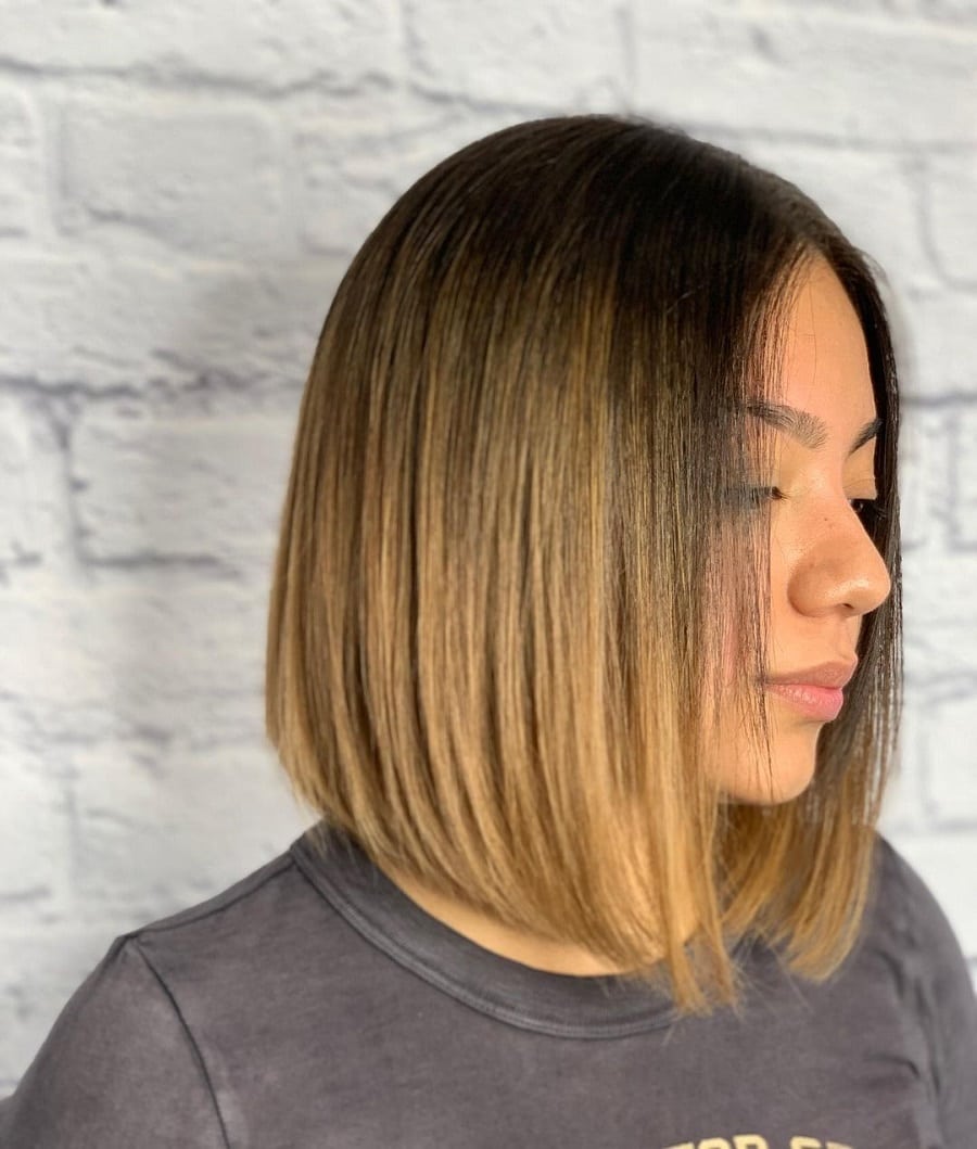 woman with angled blonde ombre lob