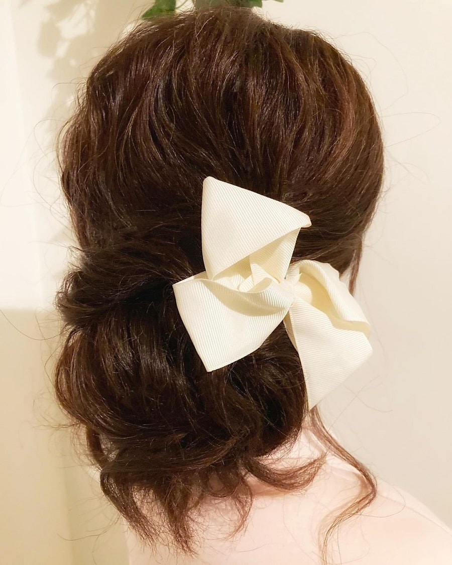 brunette medium updo with hairclip