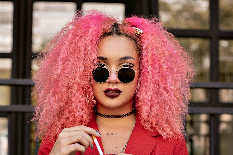woman with curly pink grunge hairstyle