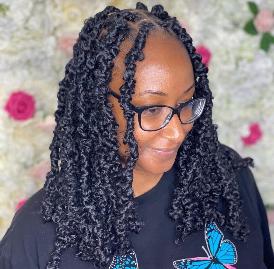black woman with passion twist braids 