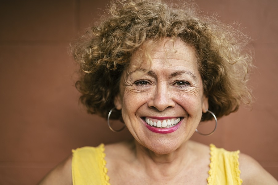 woman over 60 with curly bob
