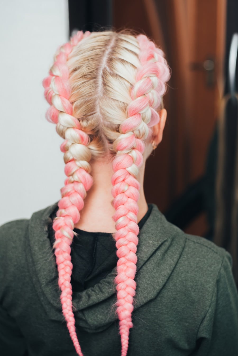 pastel pink boxer braids on blonde hair