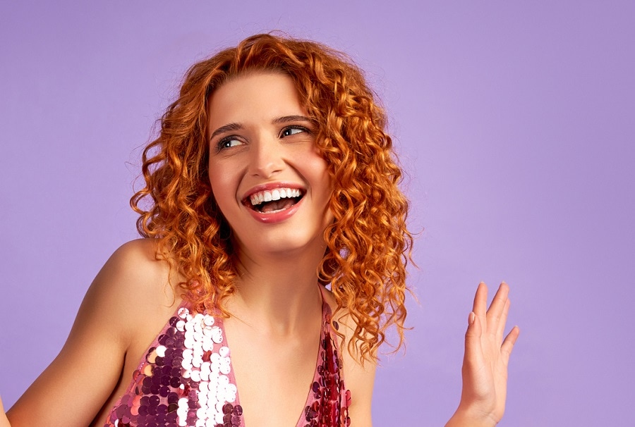 party hairstyle with red curly hair