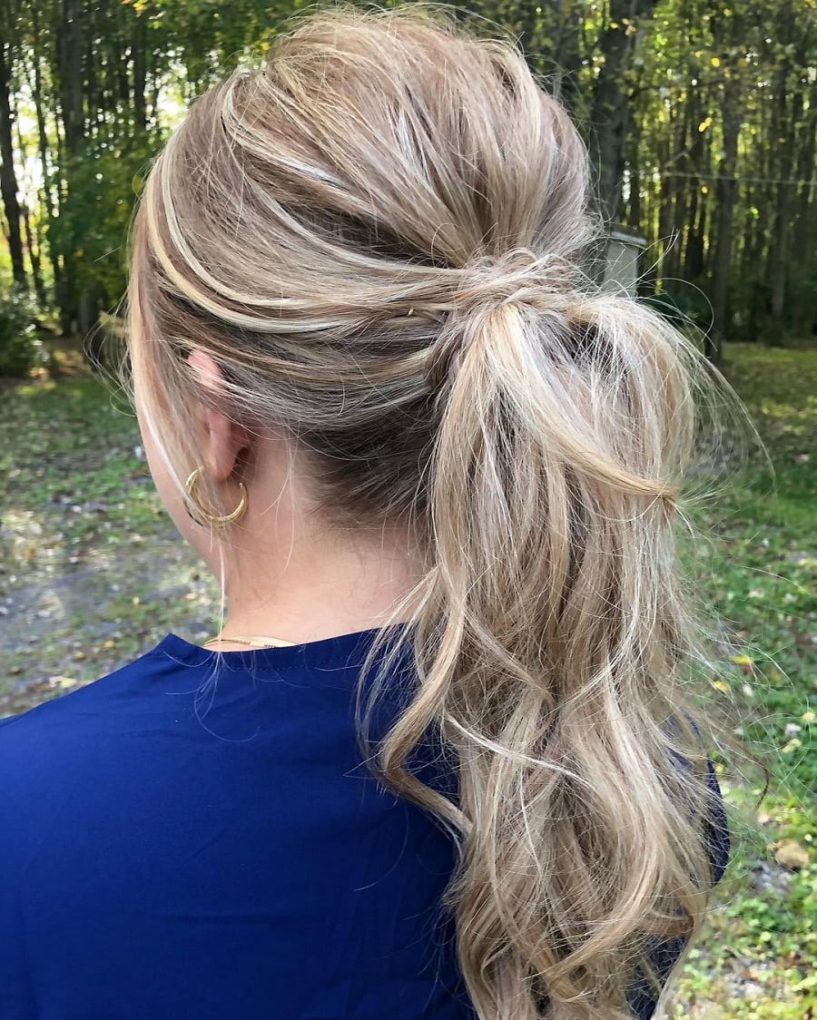 messy ponytail with thin blonde hair