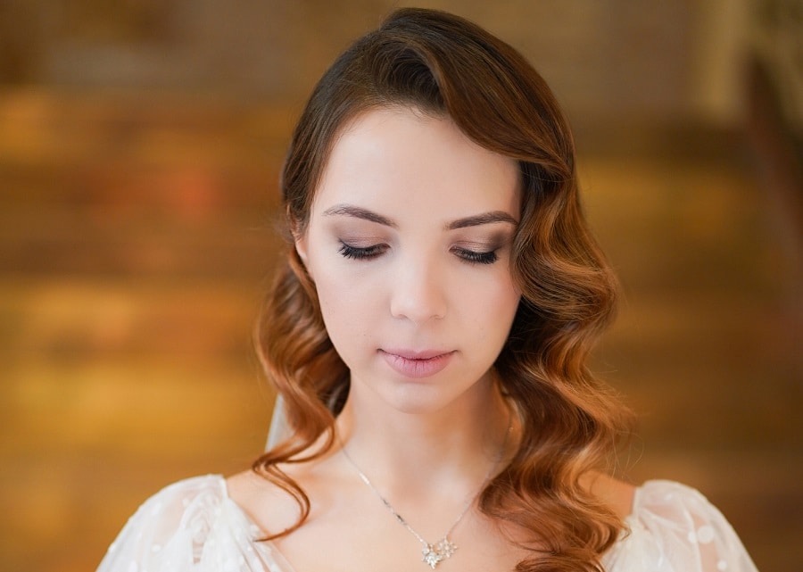 wedding hairstyle with long brown curly hair