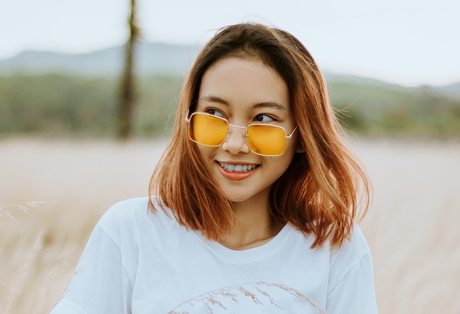 Asian girl with medium brown bob