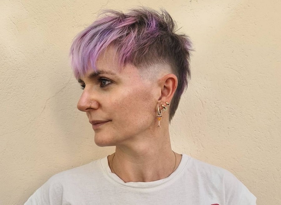 edgy pixie cut with purple highlights