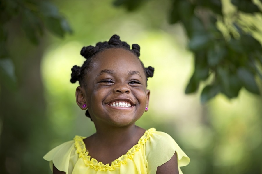 black kid with curly short hairstyle