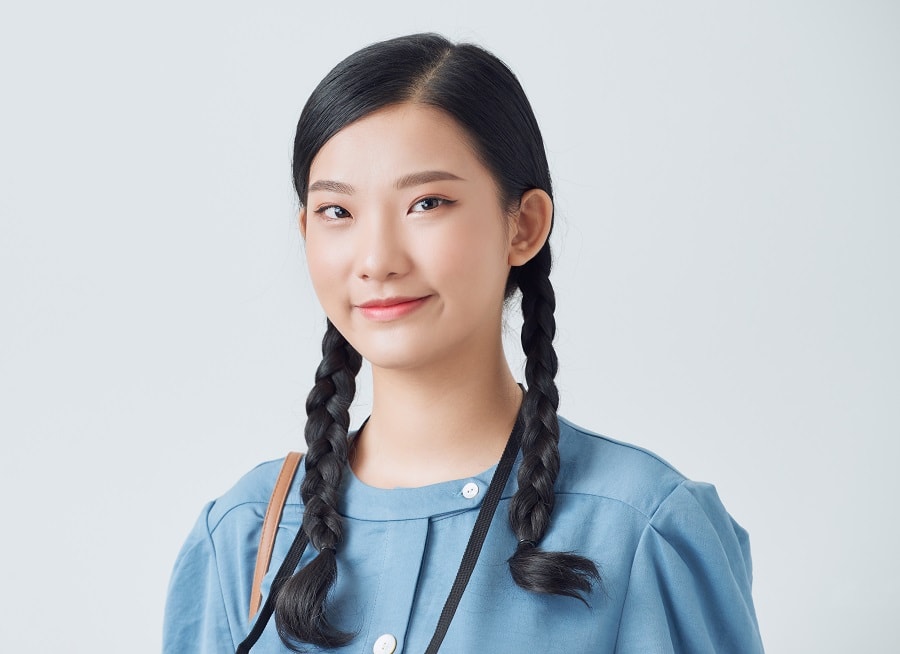 Asian girl with braided pigtails