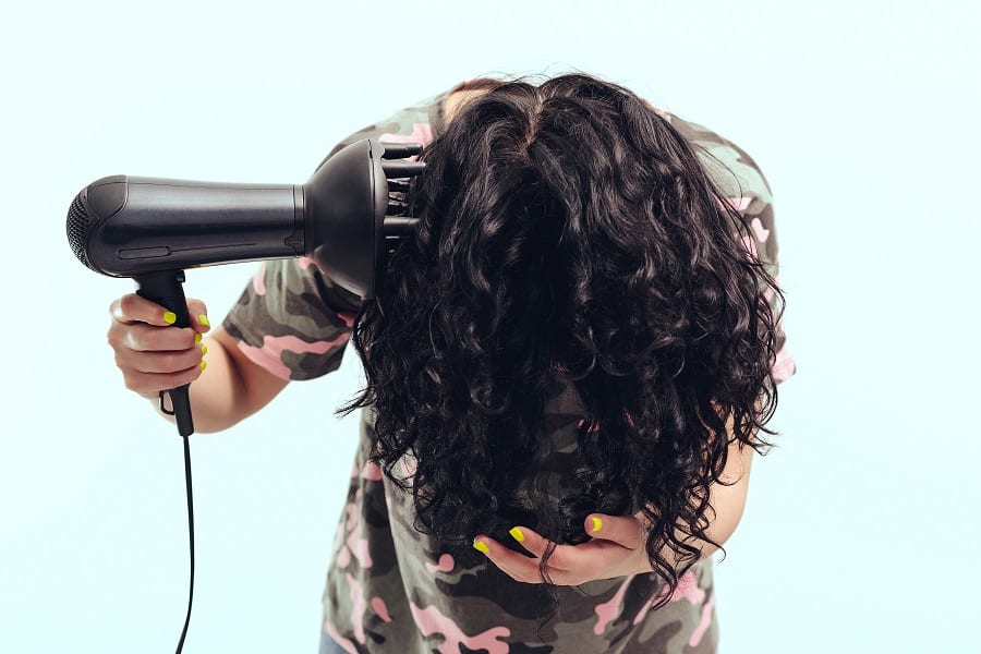 flip down curly hair to blow dry with a diffuser