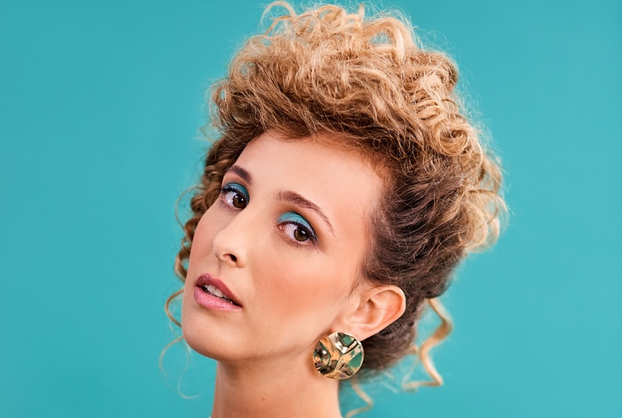 woman with 80s curly updo hairstyle
