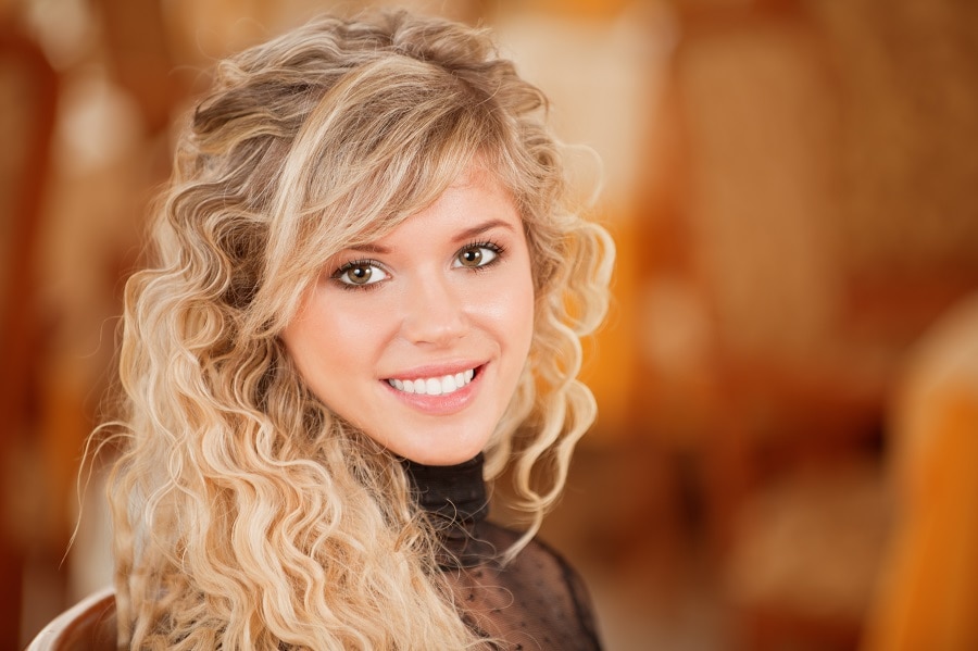 blonde curls with side bangs