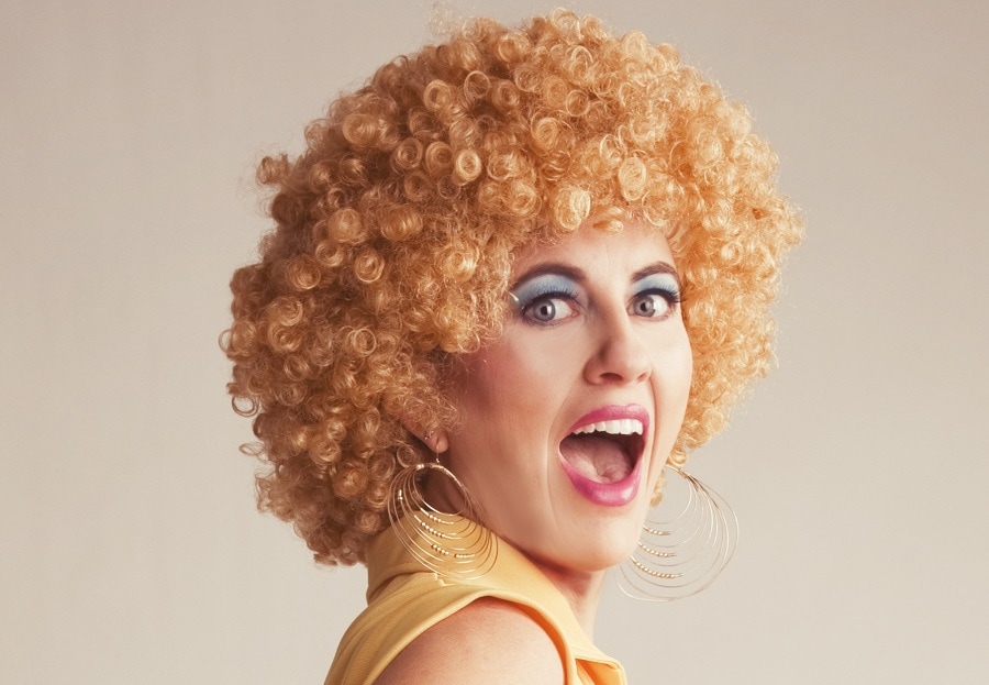 woman with short blonde curly hair