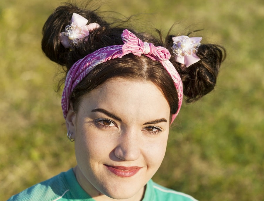 woman with double bun hairstyle