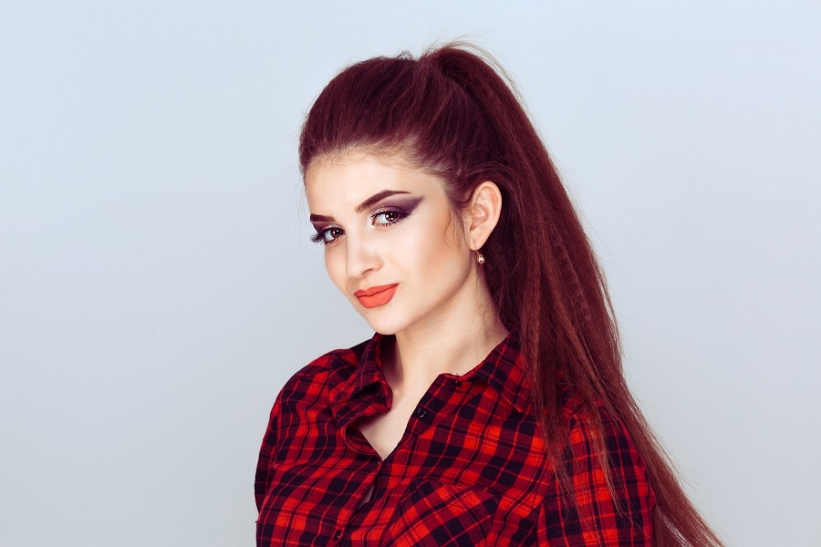 long ponytail with dark copper red hair