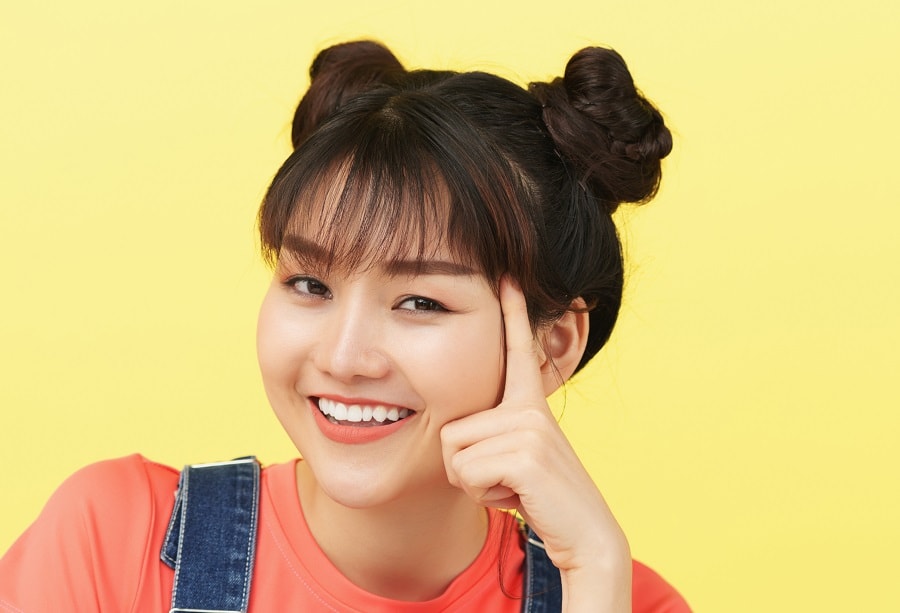 space buns with bangs