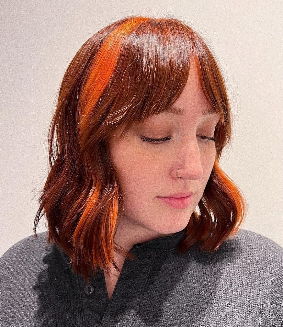 chunky orange highlights with bangs