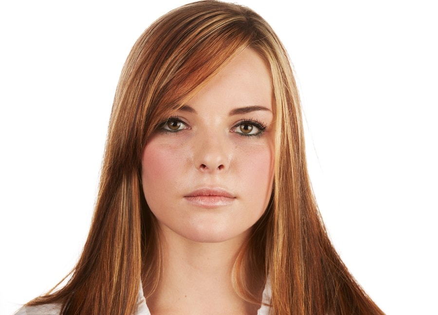 long auburn hair with side bangs and highlights