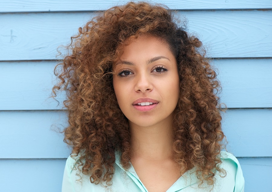 mixed girl with light brown curly hair
