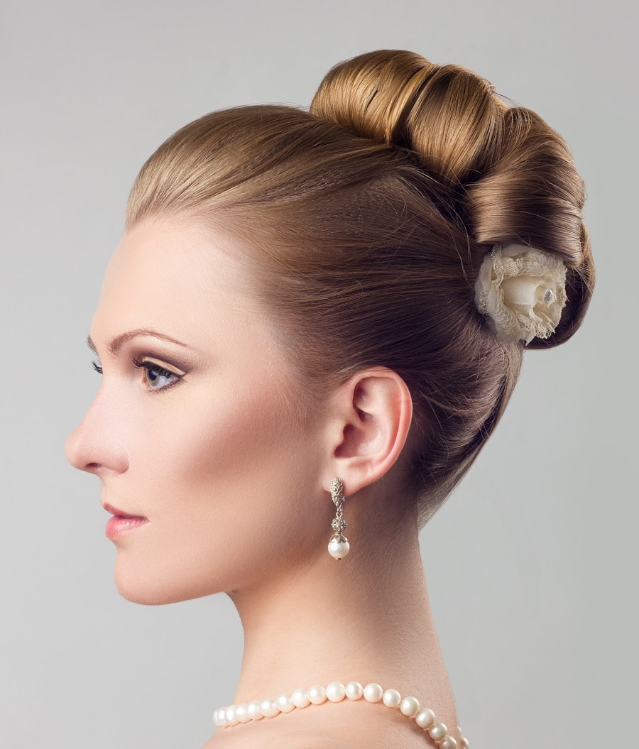 slicked back updo with copper blonde hair