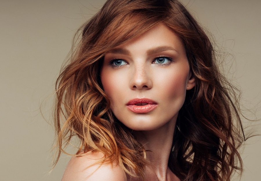 layered wavy auburn hair with highlights