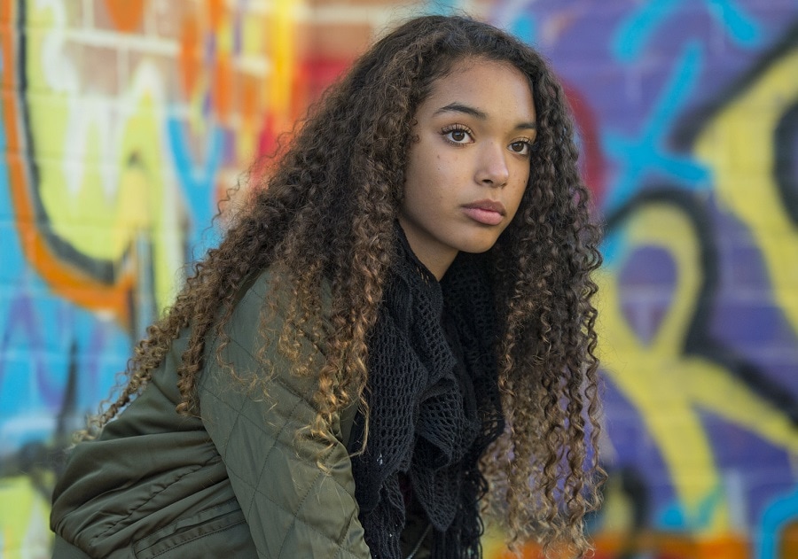 black teenage girl with long curly hair