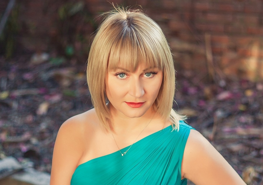 blonde bob with bangs for dress with one shoulder