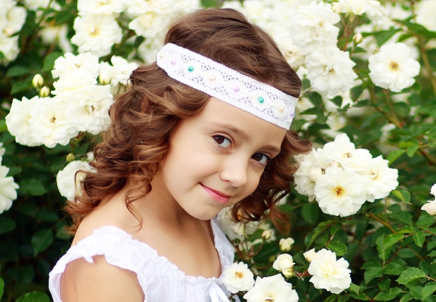 curly flower girl hairstyle with headband